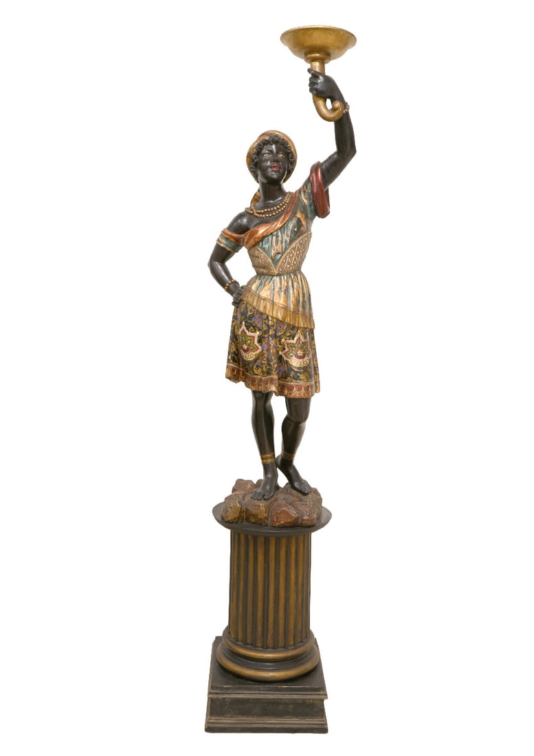 Venetian 19th C. Carved Polychromed Nubien: Venetian 19th C. hand carved polychromed Nubien figure in patterned colorful traditional dress and headwrap holding a tazza overhead and standing on a pedestal base. Measures 74.75"H total; 52.75"H x 