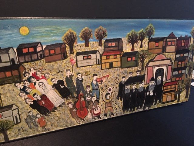 Nathan Haber / Oil on Board / The Wedding: (1902-1975) Measures 12.5 x 29. Oil on wood. Provenance on verso from Goldman's Art Gallery, Hanassi Haifa.Painting depicts a Jewish wedding inside the heart of a small village. Note : Original purcha