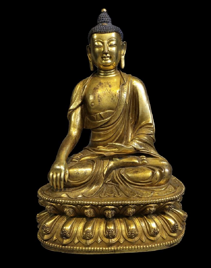 A GILT-BRONZE FIGURE OF SAKYAMUNI, MING DYNASTY (1 of 8)