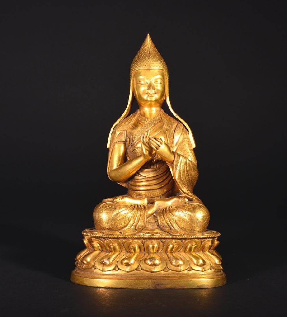 A GILT-BRONZE FIGURE OF GURU, QING DYNASTY (1 of 7)