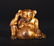 A FINE GILT-BRONZE BEAR, HAN DYNASTY