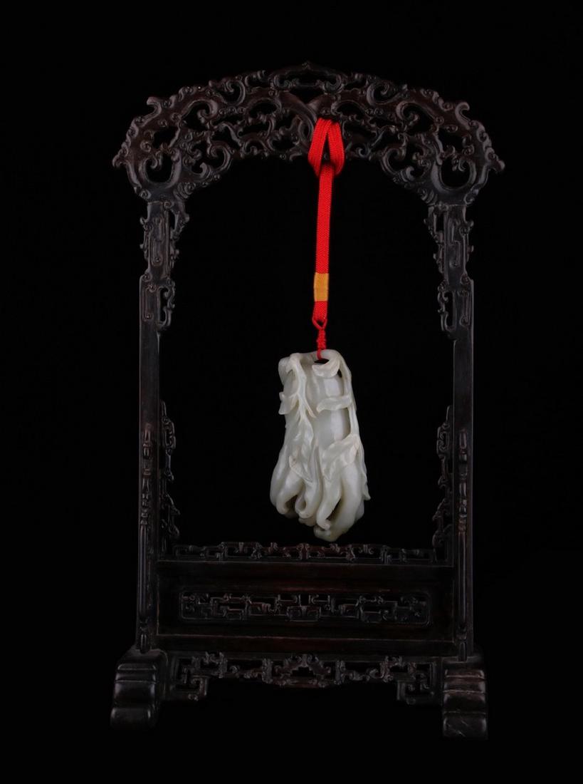 A CARVED WHITE JADE FINGERED CITRON , Qing Dynasty (1 of 5)