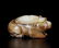 A CARVED WHITE AND RUSSET JADE BEAR , Han Dynasty