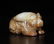 A CARVED WHITE AND RUSSET JADE BEAR , Han Dynasty - 2
