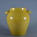 A LARGE YELLOW-GLAZED JAR.