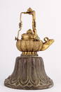 A CARVED GILT-BRONZE TEAPOT AND COVER.ANTIQUE