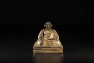 A GILT-BRONZE FIGURE OF LAMA.QING PERIOD