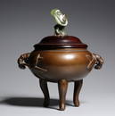 A BRONZE TRIPOD CENSER AND COVER.QING PERIOD