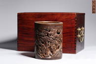 A CARVED BAMBOO 'LANDSCAPE' BRUSHPOT.QING PERIOD