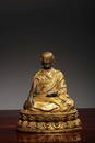 A GILT-BRONZE FIGURE OF LAMA.QING PERIOD