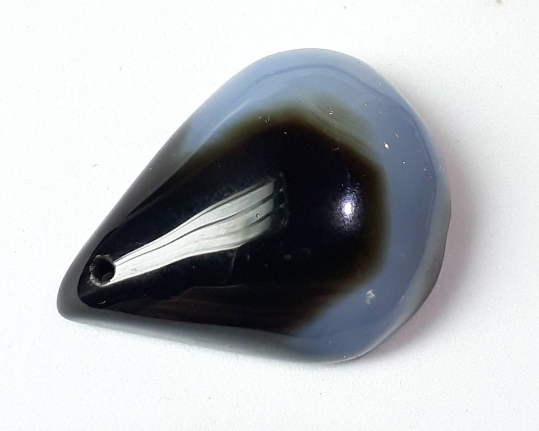 Natural Cabochon Onyx - 30.39 ct.: Natural Cabochon Onyx - 30.39 ct. , Shape - Pear , Color - Black-Yellow-White , Cabochon Cut Design with Smooth Surface , Origin - Africa , Good Quality with luster.