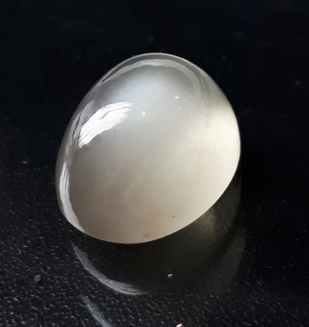 Natural Cabochon Moonstone - 19.98 ct.: Natural Cabochon Moonstone - 19.98 ct. , Color - Brownish White ,Shape - Oval , Cabochon Cut Design with smooth surface , Origin - Africa , Good Quality With Luster.