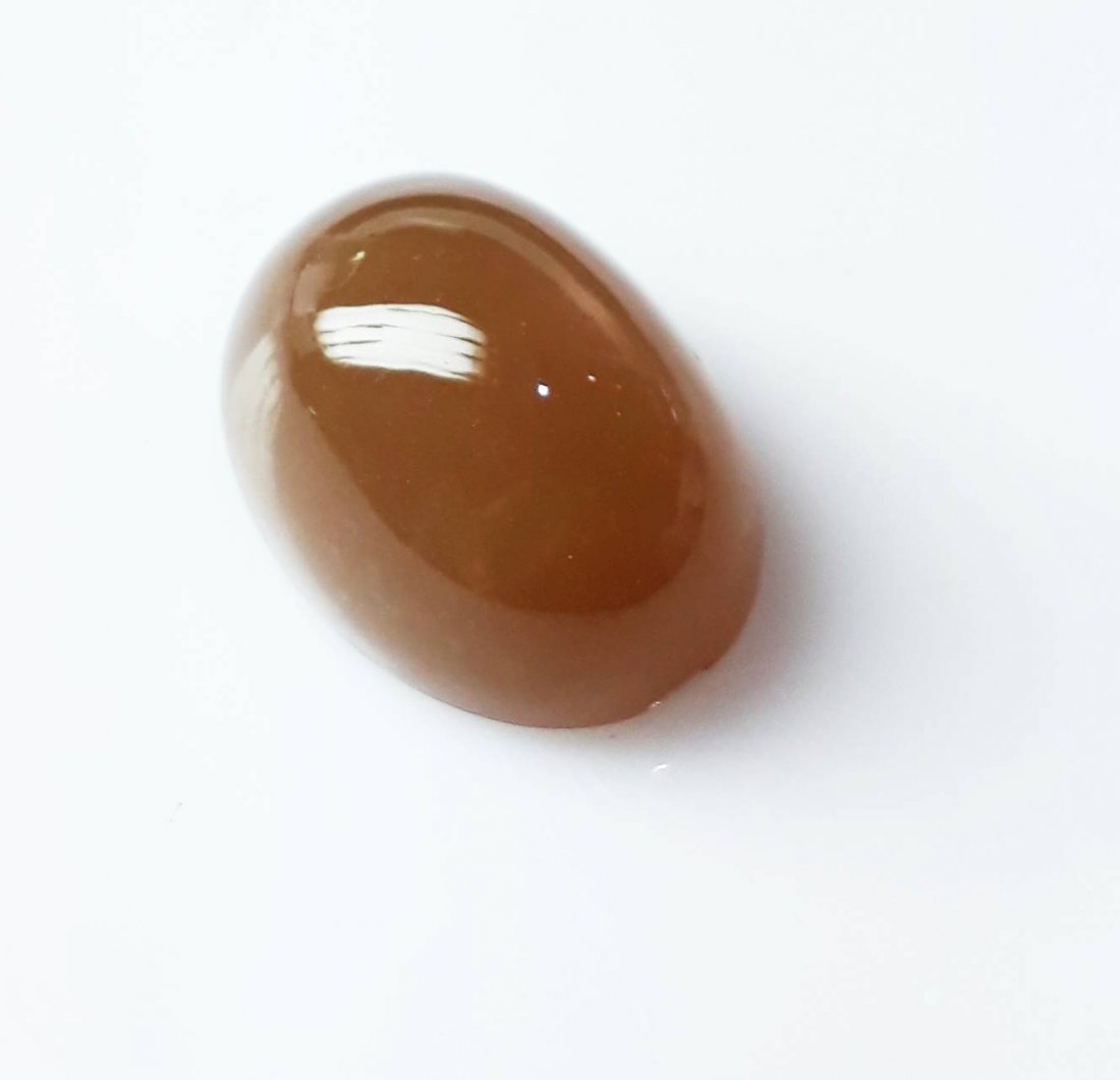 Natural Cabochon Moonstone - 17.60 ct.: Natural Cabochon Moonstone - 17.60 ct. , Color - Red ,Shape - Oval , Cabochon Cut Design with smooth surface , Origin - Africa , Good Quality With Luster.