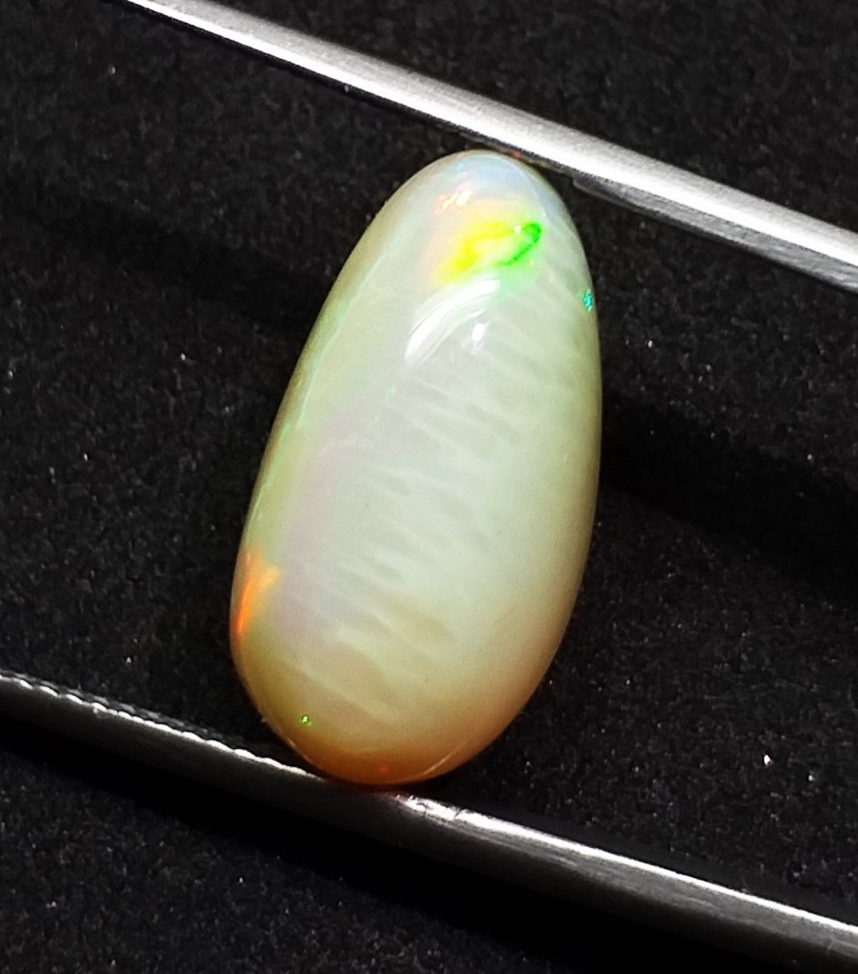 Opal 8.10 ct. - Pear - Cabochon - Natural: Natural Cabochon Opal - 8.10 ct., Color - Opaque White, Shape - Pear , Dimension - 18.9 x 10.1 x 7.7 (mm), Good Quality With Luster.