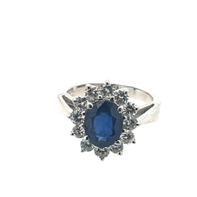 Blue sapphire and diamond halo ring