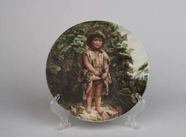 A Berlin KPM Hand Painted Plaque Depicting A Standing Boy Picking Grapes