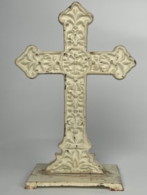A Beige Cross Cast Iron Doorstop