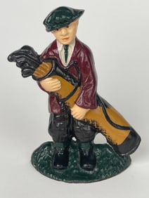 A Cast Iron Old School Golf Man With His Gear Doorstop