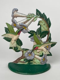 A Cast Iron Pair of Hummingbirds Feeding of a Bush of Flowers Doorstop