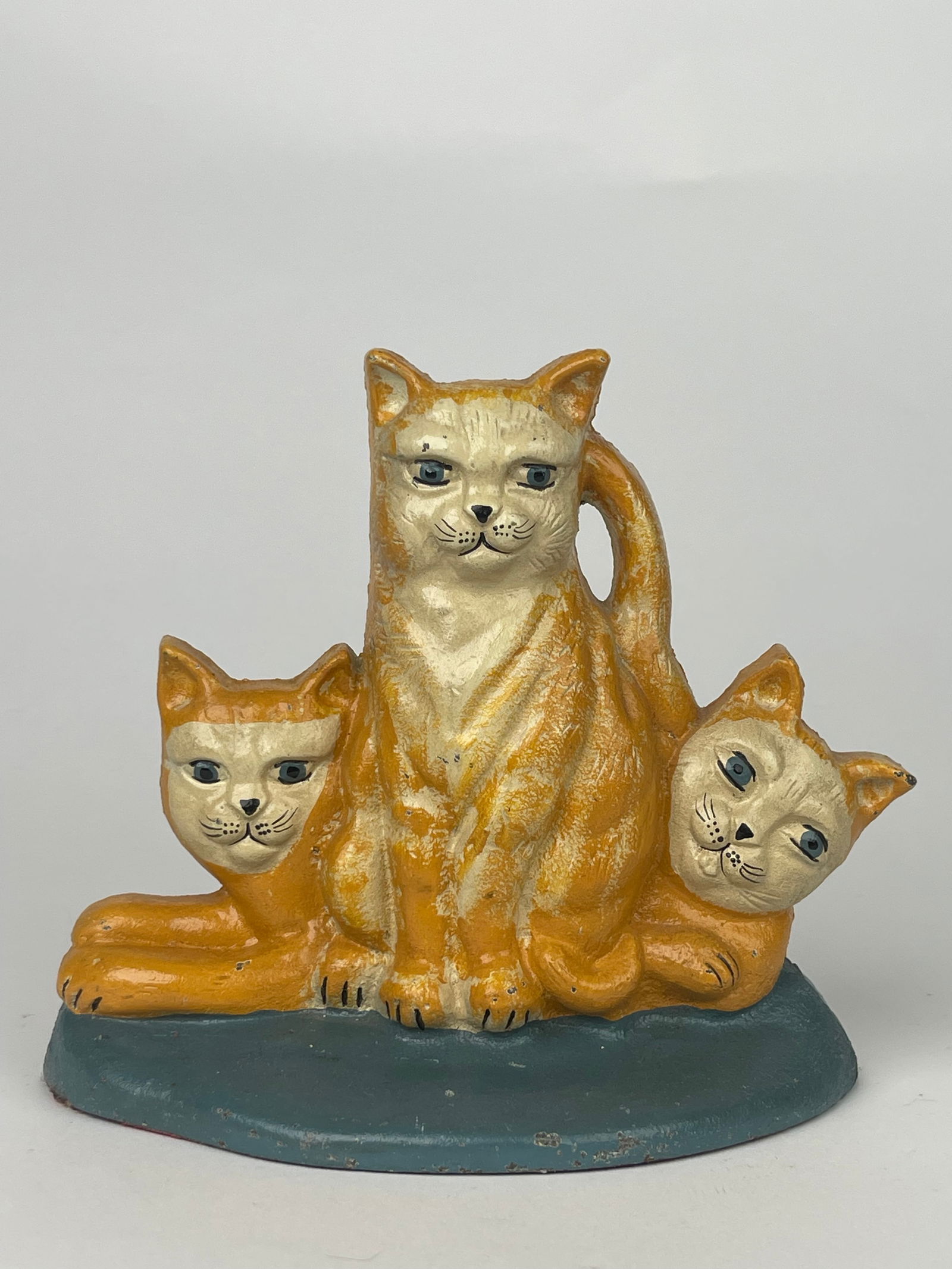 A Family of Orange Cats Cast Iron Doorstop: A Family of Orange Cats Cast Iron Doorstop. H: 6-1/2” W:7-1/2”
