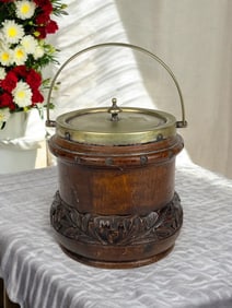An Antique British Carved Oak Ice Bucket