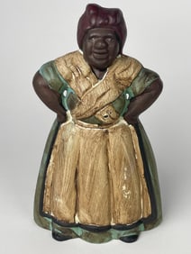 A Cast Iron Figure of a Standing Smiling Woman Doorstop