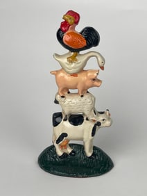 A Pile of Farm Animals Standing on Each Other Cast Iron Doorstop