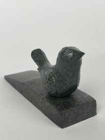 A Cast Iron Hummingbird on a Marble Style Platform Doorstop
