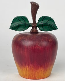 A Cast Iron Door Stop In The Shape Of An Apple