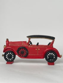 A Cast Iron Door Stop in the Shape of A Car