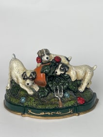 A Family of Cast Iron Dog Playing in the Garden Doorstop