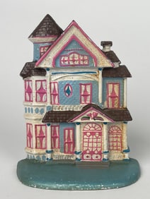 A Cast Iron Pink & Blue 3 Story Dollhouse Doorstop