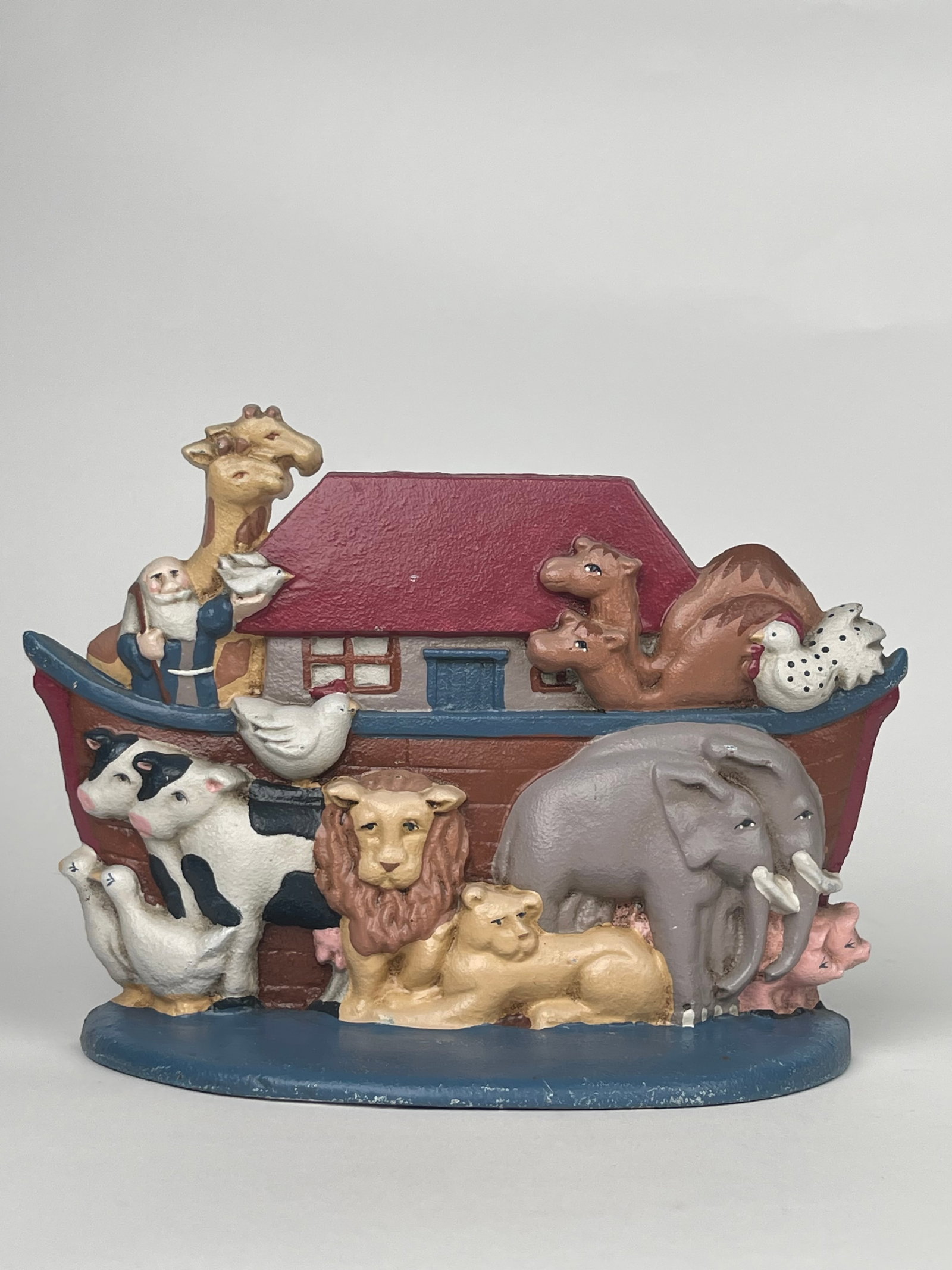 A Cast Iron Doorstop Boat of Moses & His Animals: A Cast Iron Doorstop Boat of Moses & His Animals. H: 7: W:9-1/2”