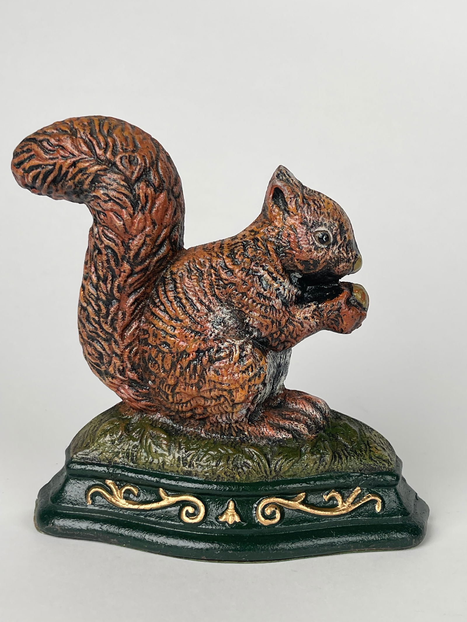 An Eating Nut Squirrel Cast Iron Doorstop: An Eating Nut Squirrel Cast Iron Doorstop. H: 6-1/4” W:6-1/4”