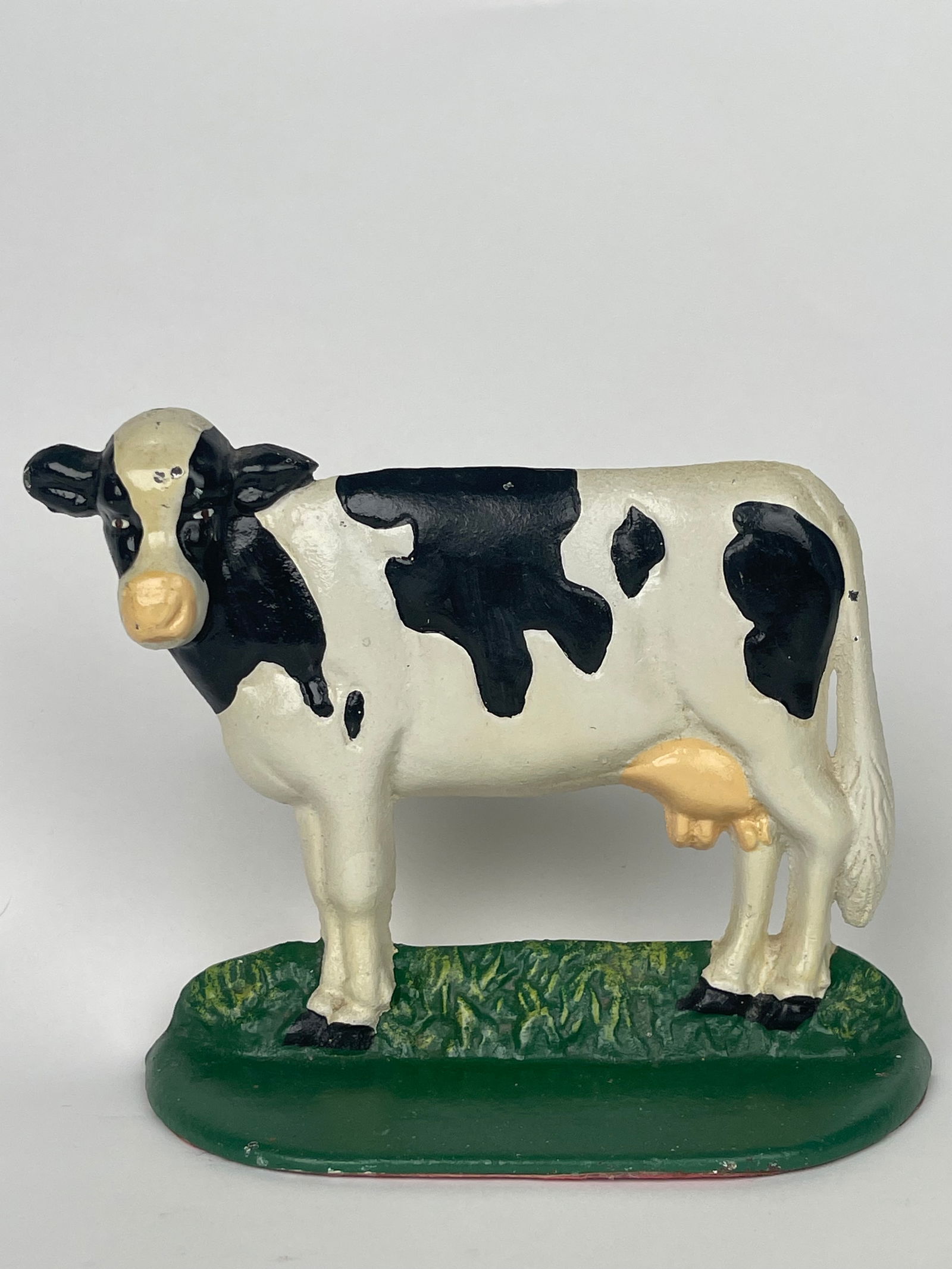 A Cast Iron Farm Cow Doorstop: A Cast Iron Farm Cow Doorstop. H: 5-1/2” W:7”