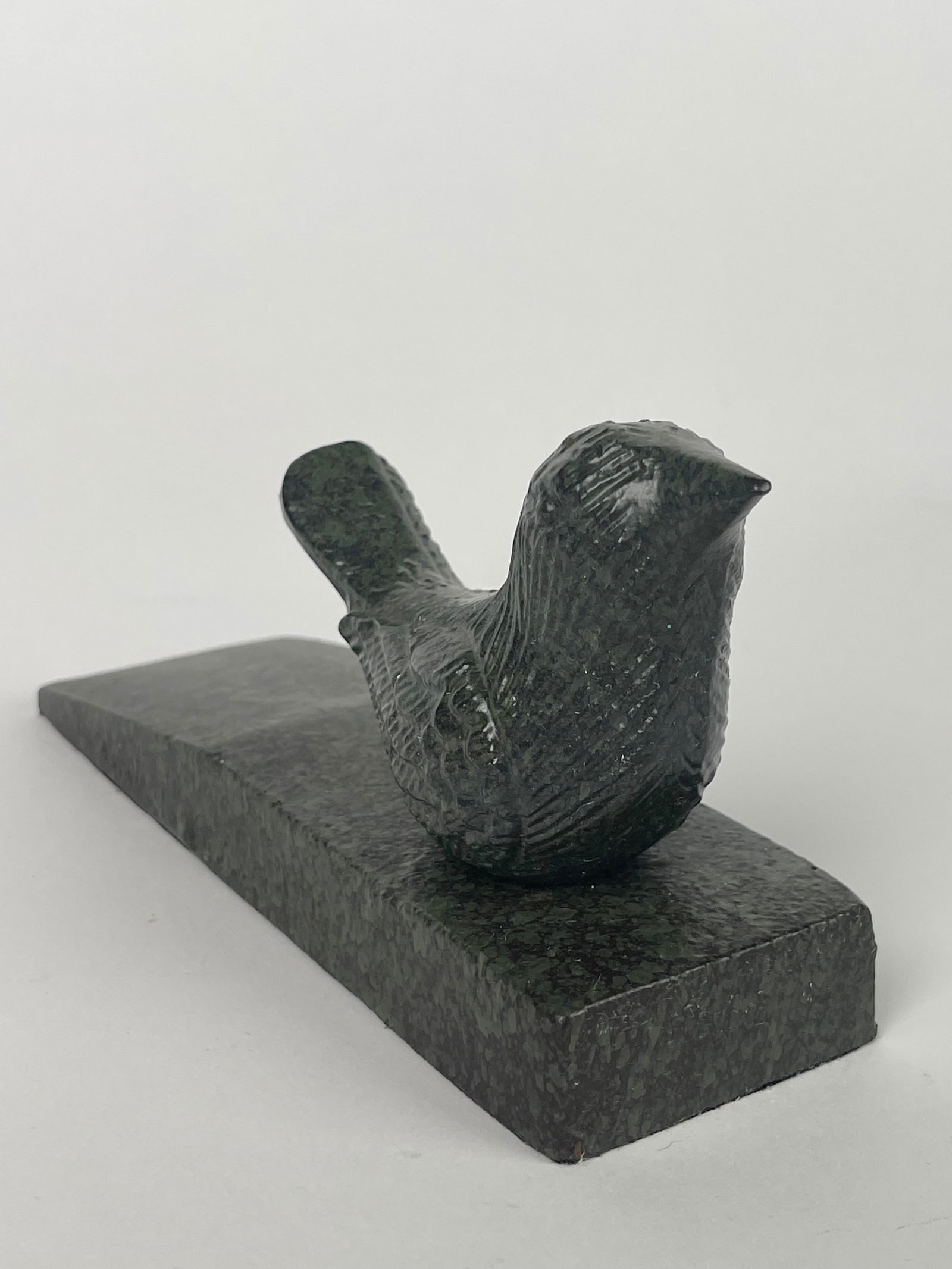 A Cast Iron Hummingbird on a Marble Style Platform Doorstop: A Cast Iron Hummingbird on a Marble Style Platform Doorstop. H: 3-1/8” W:2” D:7-3/4”