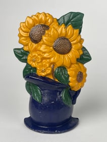 A Cast Iron Bouquet of Sunflowers in a Blue Vase Doorstop