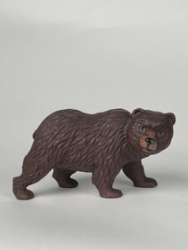 A Figure of a Walking Bear Doorstop