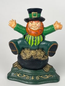 A St. Patrick’s Day Cast Iron Leprechaun Sitting on a Pot of Gold Doorstop