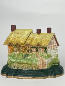 A Flowery Cottage Cast Iron Doorstop
