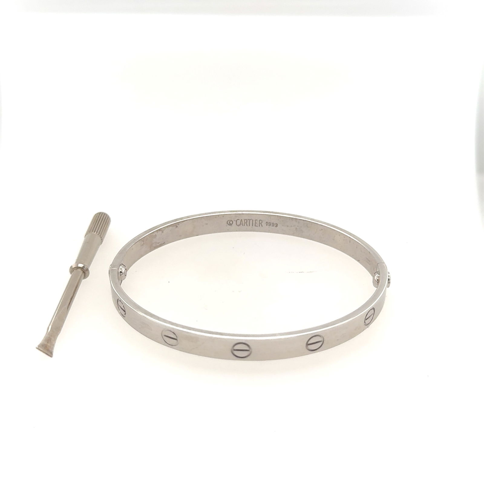 Cartier Ladies 18K White Gold Bangel: Cartier Ladies 18K White Gold Bangel. Size: 19 Total Weight: 37.3grams Original box (No #E49874)