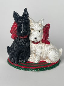 A Cast Iron pair of a Black & White Scottish Terriers Doorstop