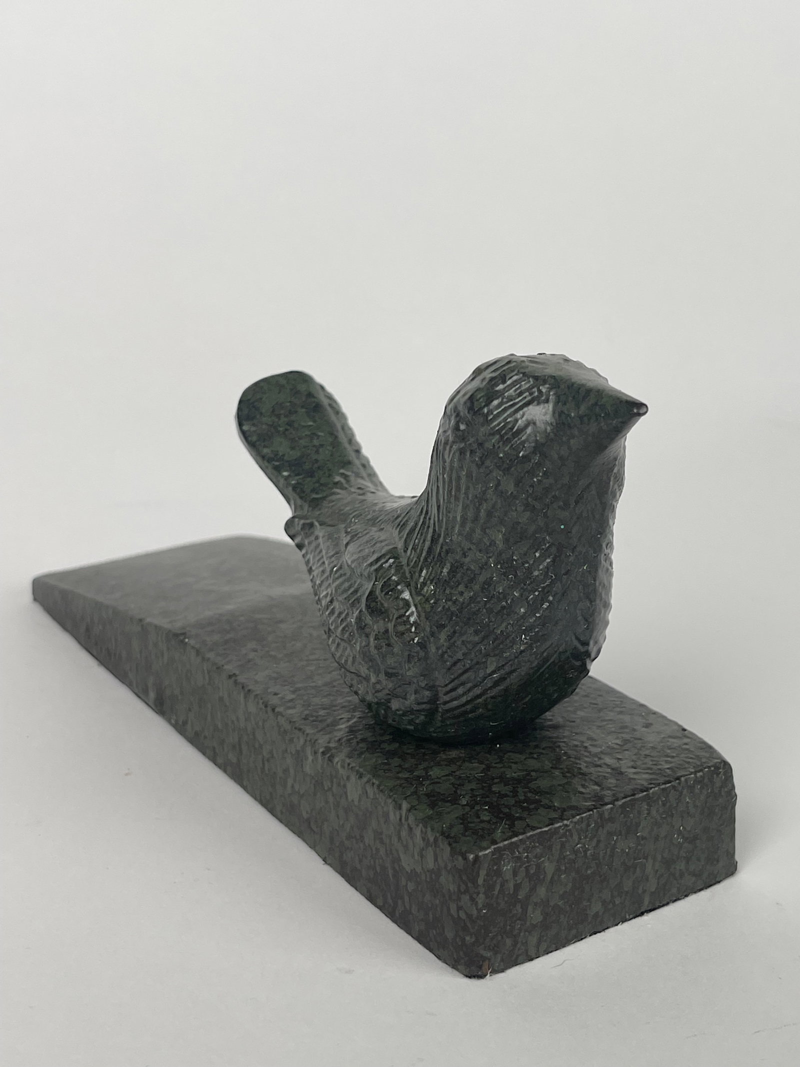 A Cast Iron Hummingbird on a Marble Style Platform Doorstop: A Cast Iron Hummingbird on a Marble Style Platform Doorstop. H: 3-1/8” W:2” D:7-3/4”