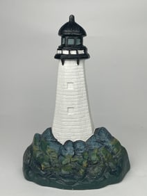 A Tall Cast Iron Lighthouse Doorstop