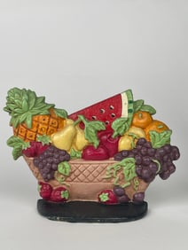 An Assortment of a Cast Iron Fruit Bowl Doorstop