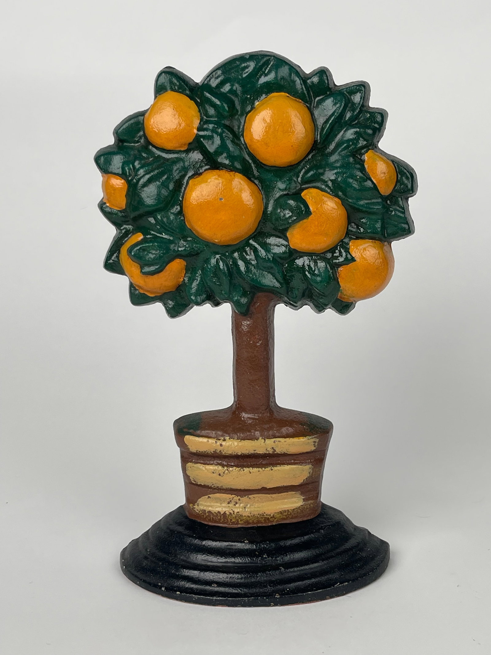 A Cast Iron Orange Tree With Brown & Golden Pot Doorstop: A Cast Iron Orange Tree With Brown & Golden Pot Doorstop. H:10-1/4” W:6-1/2”