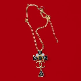 An authentic 18k Gold Plated Pearl & Black Enameled Chanel Necklace