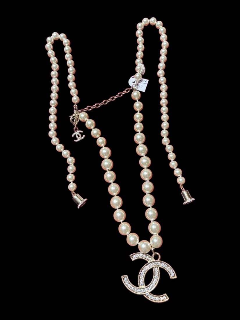 An Authentic 18K gold Plated Pearl Chanel Necklace: An Authentic 18K gold Plated Pearl Chanel Necklace. Stamped Chanel Hallmark On The Clasp.