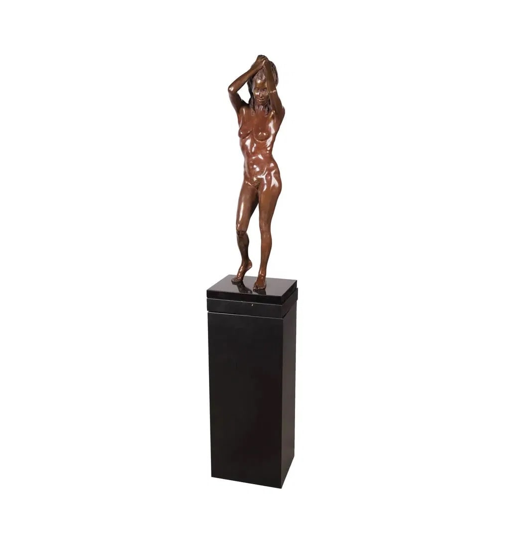 A Bronze Figure of a Female Nude: 1986; mounted to revolving black marble base and pedestal; ed. 5/15; signed illegibly, numbered and dated to foot Figure: 34 1/2 x 8 x 7 in. (87.6 x 20.3 x 17.8 cm.), Overall: 67 x 12 x 10 in. (170.2