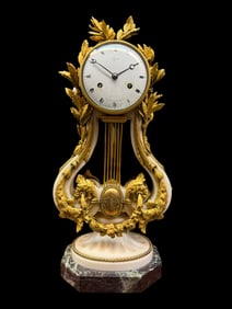 An Ormolu Mounted Marble Clock By Jean Joseph Lepante